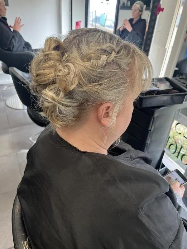 Blonde braided up-do for a special occasion at Harvey's Hairdressers, Luton