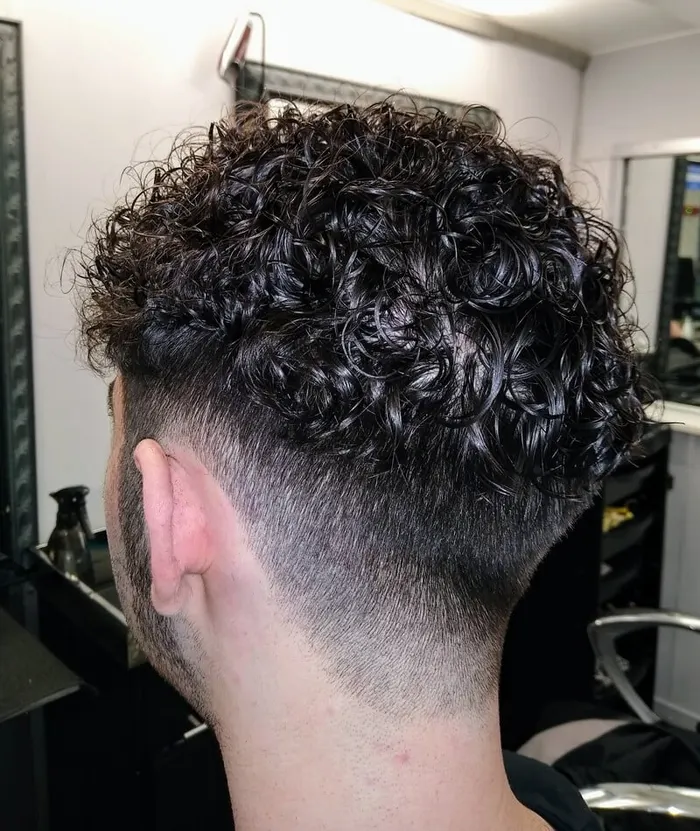 Men's perm with tapered back and sides at Harvey's Hairdressers, Luton